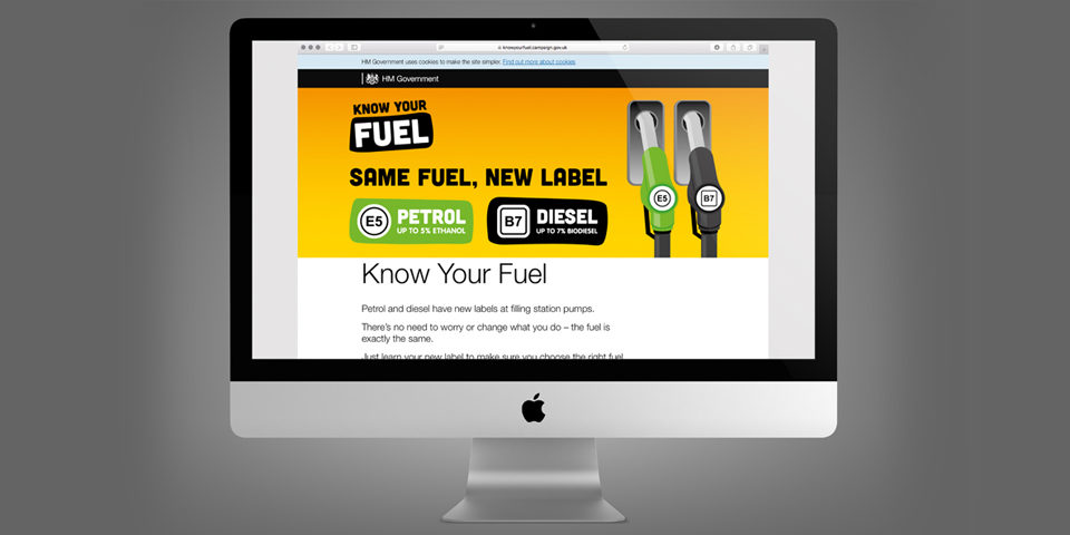 A Know Your Fuel webpage, depicted on a Mac screen. It features a large yellow banner with the fuel pump graphics and the slogan 'Same fuel new label'.