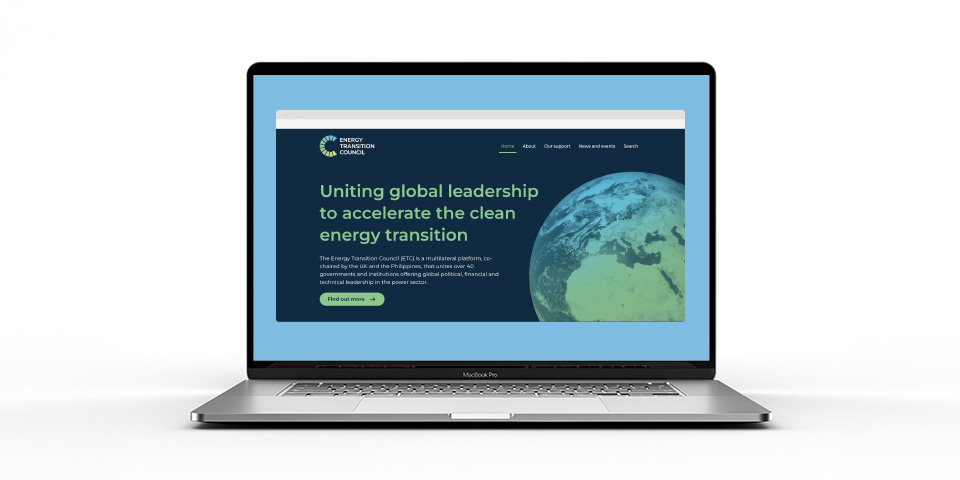 The homepage for the Energy Transition Council's website is displayed on a laptop screen