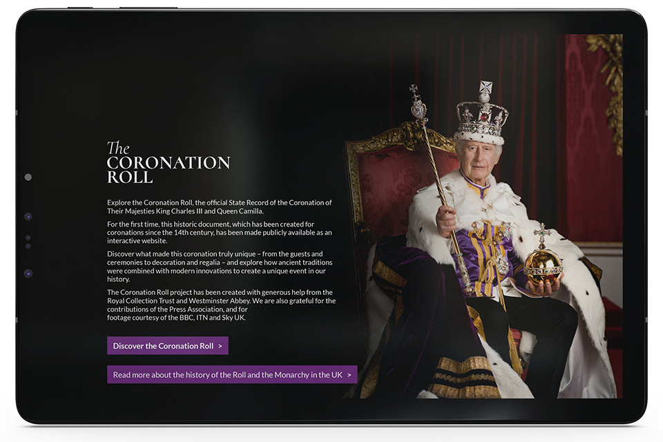 A tablet displays the homepage of the digital Coronation Roll